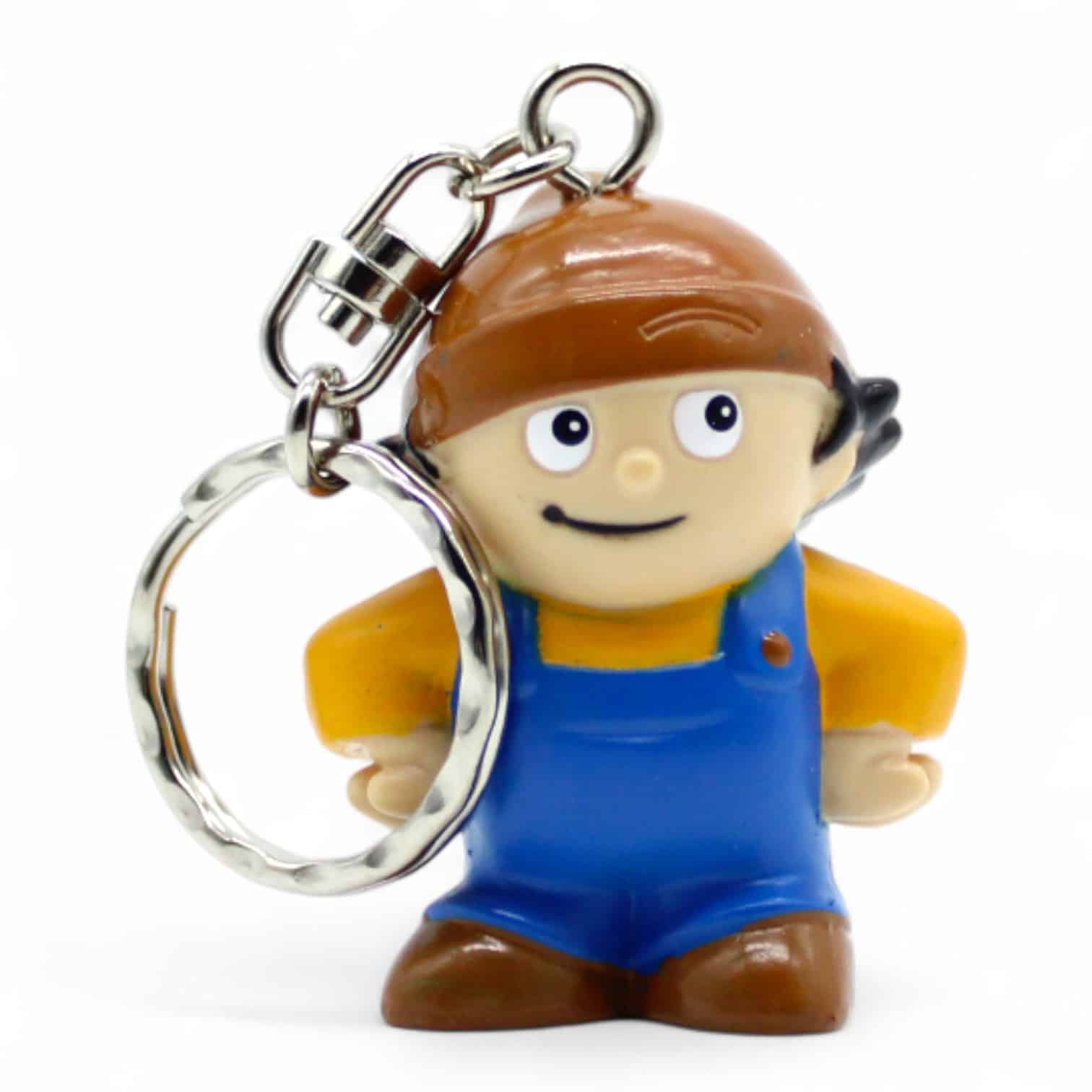 Figur eines Handwerkers mit brauner Mütze als Schlüsselanhänger. Vorderseite