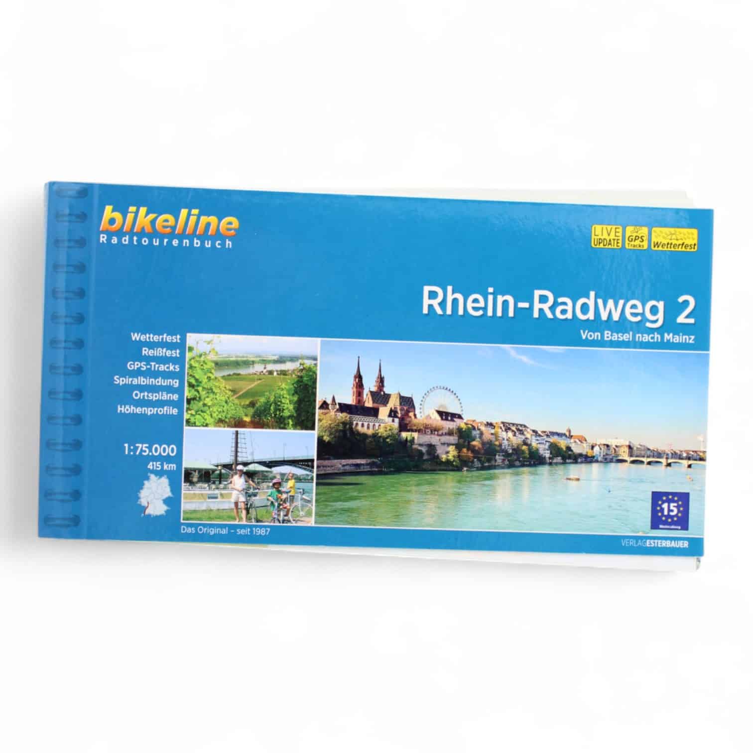 Spiralgebundenes blaues Heft mit einem Bild vom Rheinufer auf der Vorderseite