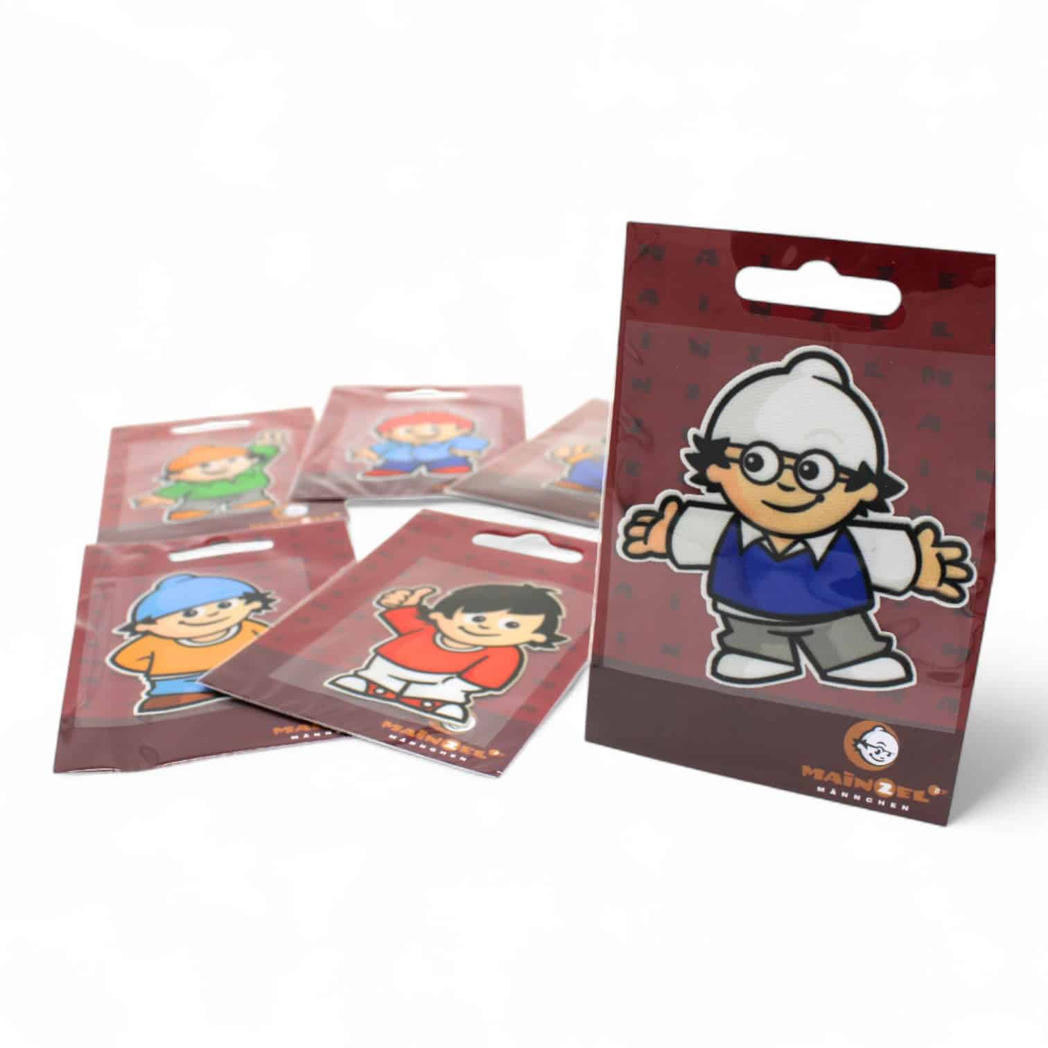 6 Mainzelmännchen Bügelpatches mit den einzelnen Mainzelmännchen als Motiv und Det als Motiv aufrecht.