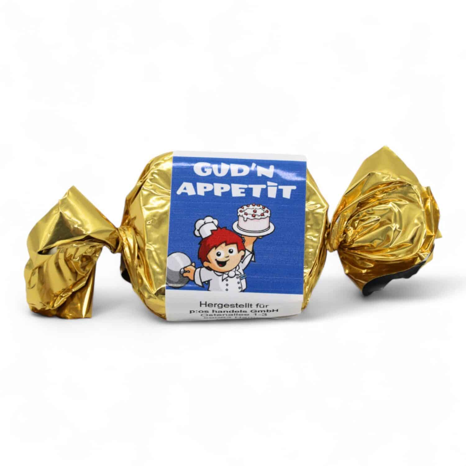 Ein einzelner in goldenem Papier verpackter Nougat Happen mit Mainzelmännchen