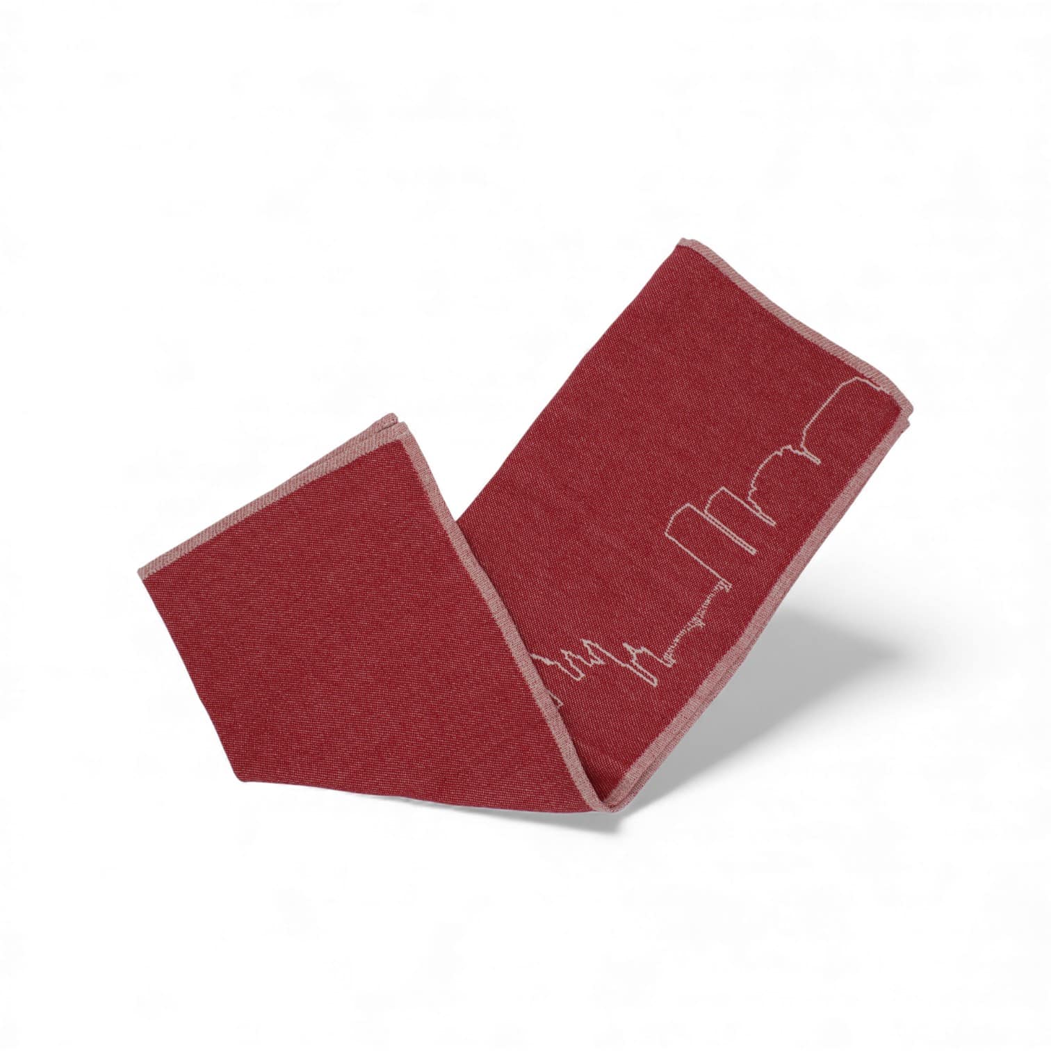 Rotes Geschirrtuch mit weiß bestickter Silhouette der Mainzer Skyline, gefaltet